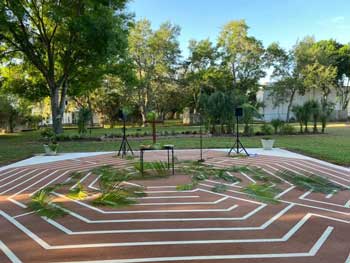 The labyrinth on the church campus with fronds strewn from Palm Sunday