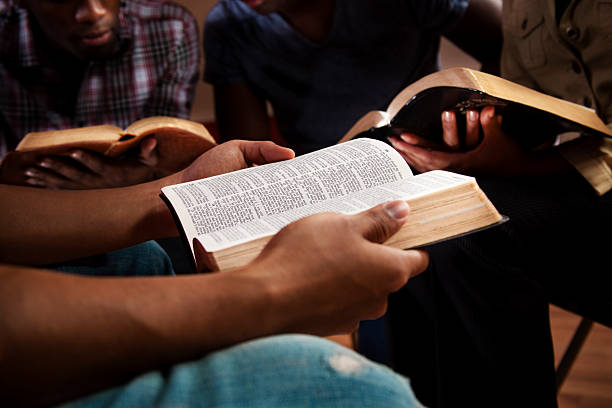 Person holding an open bible during Bible Study - part of the Reflection and Renewal Offerings at the Oasis Center