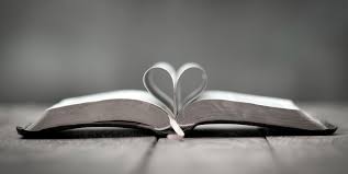 Bible with pages turned in the shape of a heart